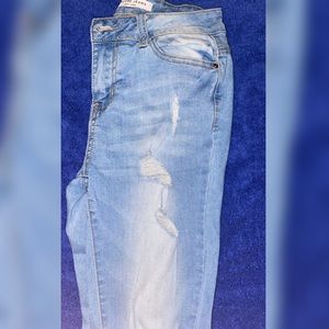 Light blue ripped jeans